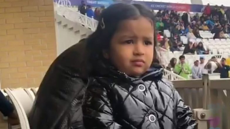 IND vs NZ, ICC CWC 2019: नॉटिंघम में लगातार हो रही बारिश से परेशान दिखीं नन्ही जीवा, देखें तस्वीरें