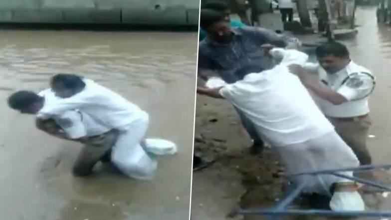 हैदराबाद में ट्रैफिक इंस्पेक्टर ने पेश की मानवता की मिसाल, 'बेबस' शख्स को पीठ पर उठाकर पानी से भरी सड़क पार करवाई, देखें Video हैदराबाद में ट्रैफिक इंस्पेक्टर ने पेश की मानवता की मिसाल, 'बेबस' शख्स को पीठ पर उठाकर पानी से भरी सड़क पार करवाई, देखें Video