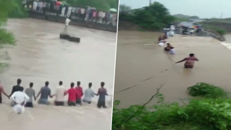 इंदौर: पानी में बह रहे लोगों को बचाने के लिए सैकड़ों लोगों ने बनाया ह्यूमन चैन, देखें VIDEO इंदौर: पानी में बह रहे लोगों को बचाने के लिए सैकड़ों लोगों ने बनाया ह्यूमन चैन, देखें VIDEO