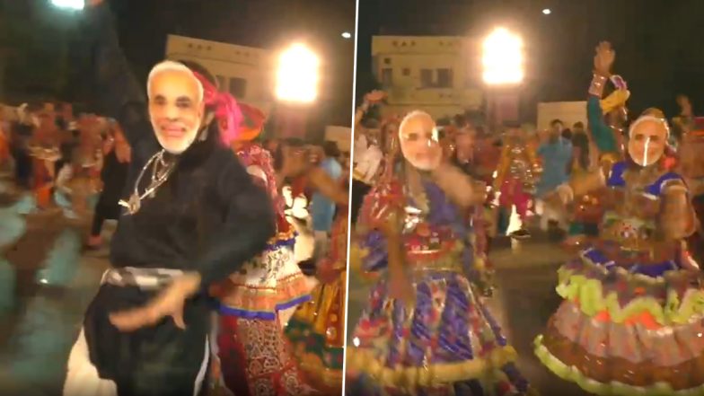 गुजरात: सूरत में लोगों ने पीएम मोदी का मास्क पहनकर खेला गरबा, देखें वीडियो