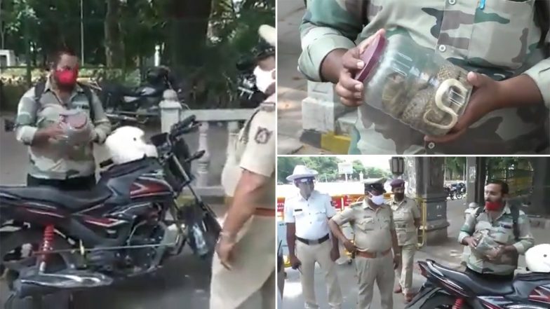 Mysore: लॉकडाउन में बाहर निकले बाइकर को पुलिस ने रोका, तो शख्स ने दिखाया कोबरा, देखें VIDEO