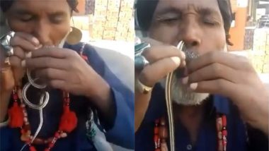 Viral Video: नाक में सांप को डालते हुए एक शख्स का वीडियो हुआ वायरल, जिसे देख लोग हुए हैरान