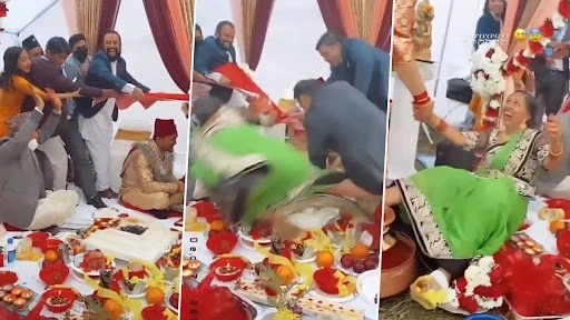शादी के मंडप में रस्साकशी के दौरान मेहमान मंडप में गिरे, वायरल वीडियो देख हो जाएंगे लोटपोट
