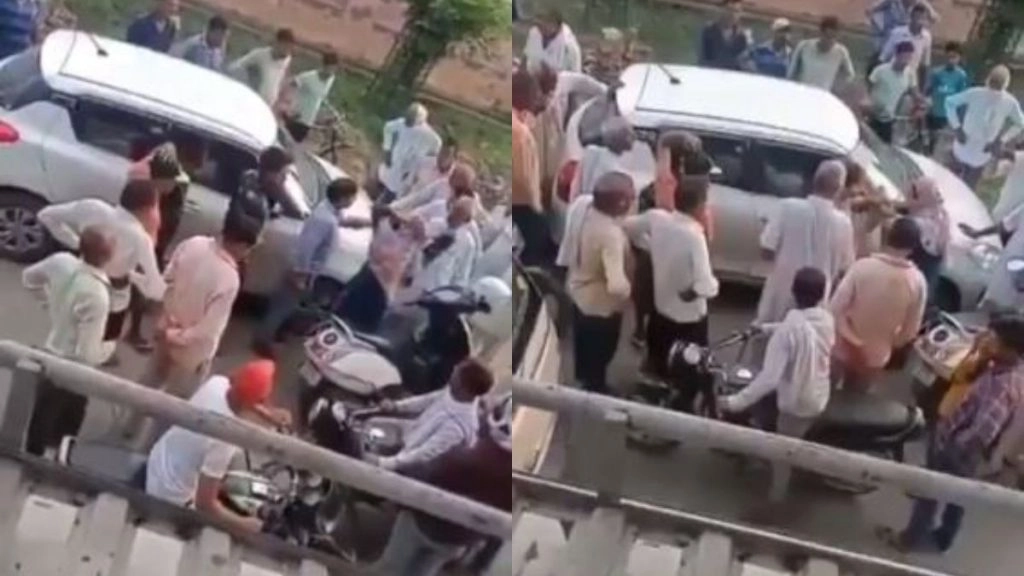 बीच सड़क पर महिला ने कर दी कार चालक की पिटाई, सोशल मीडिया पर वायरल हुआ हैरान करने वाला वीडियो 