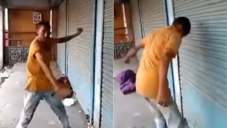 नशे में धुत होकर दुकान के शटर पर बार-बार सिर पटकने लगा शख्स, मजेदार Viral Video देख नहीं रुकेगी आपकी हंसी
