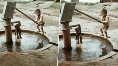 Viral Video: प्यासे कुत्ते को पानी पिलाने के लिए छोटे बच्चे ने चलाया हैंडपंप, वीडियो देख लोग हुए इमोशनल