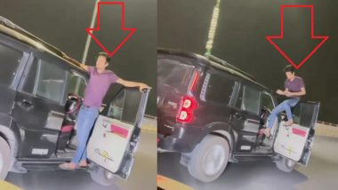 UP: सीट छोड़ युवक ने चलती कार पर किया खतरनाक स्टंट, वीडियो वायरल होने के बाद अब पुलिस निकालेगी हीरोगिरी