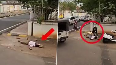 भीषण गर्मी और लू के चलते बेहोश होकर सड़क पर गिरा पुलिसकर्मी, महिला और बच्ची ने ऐसे की मदद (Watch Viral Video)
