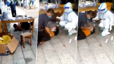Viral Video: चीन में महिला को COVID टेस्ट के लिए जमीन पर जबरदस्ती लिटाकर लिया गया स्वैब सैंपल, देखें वीडियो