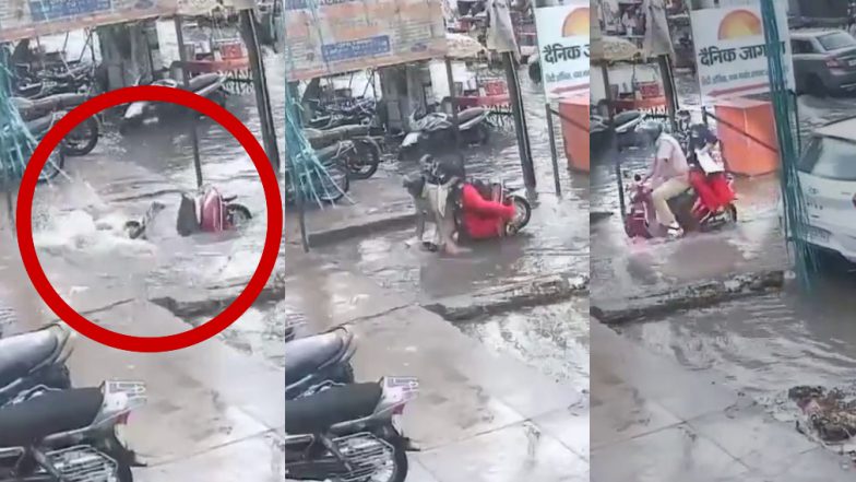 Viral Video: अचानक पानी से भरे गड्ढे में जा समाए स्कूटी सवार पति-पत्नी, CCTV फुटेज देख डर गए लोग