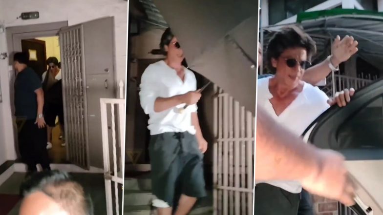 कैमरे से बचने के लिए शाहरुख खान ने लिया छाते का सहारा- देखें वीडियो