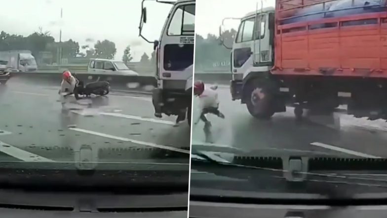 OMG! तेज रफ्तार ट्रक के नीचे आने से बाल-बाल बचा शख्स, दिल दहला देने वाले एक्सीडेंट का वीडियो हुआ वायरल