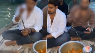 Prayagraj Viral Video: गंगा में नाव पर चिकन बनाने और हुक्का पीने का वीडियो वायरल, जांच में जुटी पुलिस