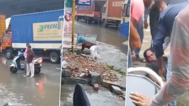 Viral Video: बरसात में पानी से भरी सड़क पार करने के दौरान शख्स का फिसला पैर, बह गया नाले में, देखें वीडियो