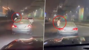 Noida Viral Video: नोएडा में तेज रफ्तार कार की खिड़की से बाहर निकलकर स्टंट करती दिखी युवती, लड़की की तलाश में जुटी पुलिस