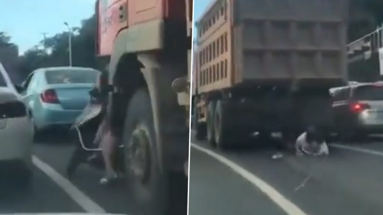 तेज रफ्तार ट्रक के नीचे आई लड़की ने दिया मौत को चकमा, Viral Video में देखें कैसे बाल-बाल बची जान
