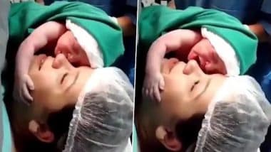 Viral Video: मां का चेहरा पकड़े नवजात बच्चे का क्यूट वीडियो वायरल, नेटीजंस ने कहा- 'सो क्यूट'