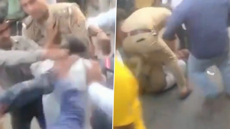 VIDEO: यूपी के कासगंज में शख्स की दबंगई, लोगों के बीच पुलिसवाले को जड़े थप्पड़, मचा हंगामा