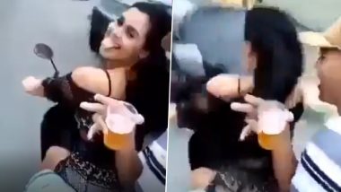 Viral Video: स्कूटी चलाते हुए बीयर पार्टी करने लगी लड़की, अचानक बिगड़ा बैलेंस और फिर...