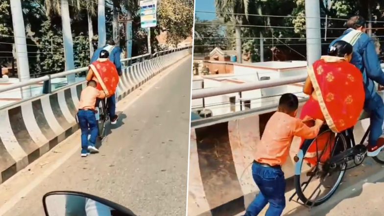 Son Helping Mom-Dad Cute Video: फ्लाईओवर पार करने में बेटे ने की साइकिल सवार माता-पिता की मदद, बच्चे ने जीता सबका दिल