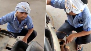 UP: जालौन में पेट्रोल पंप कर्मचारियों ने स्कूटर में भरे तेल, 2 हजार के नोट देखते ही टंकी से वापस निकाले (Watch Viral Video)