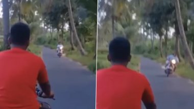 बगैर हेलमेट के बाइक चला रहा था शख्स, तभी अचानक से सिर पर गिरा नारियल और फिर... (Watch Viral Video)