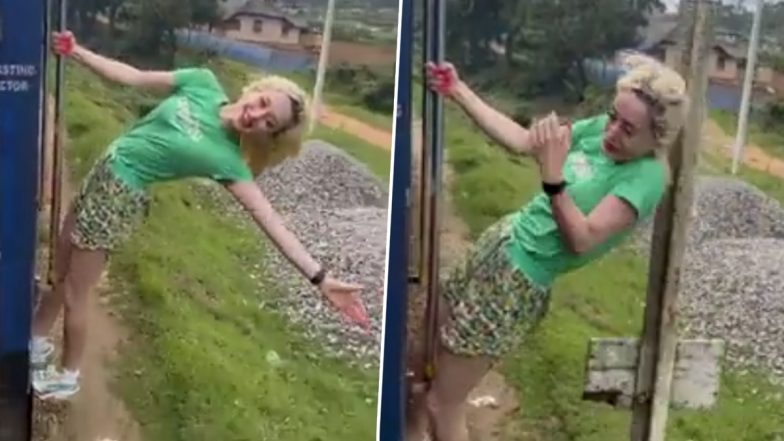 Viral Video: तेज रफ्तार ट्रेन के गेट पर लटक कर लड़की ने की ऐसी हरकत, हैरान करने वाला वीडियो हुआ वायरल