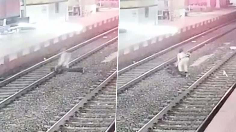 Video- RPF Lady Constable Foils Suicide Attempt: जिंदगी खत्म करने पटरी पर लेटा शख्स, तेज रफ़्तार से आ रही थी ट्रेन, महिला कांस्टेबल ने बचा ली जान