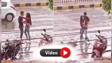 Couple Rain Dance Video: बारिश में बीच सड़क पर कपल ने किया रोमांटिक डांस, लोगों को लगा फिल्म की हो रही शूटिंग!