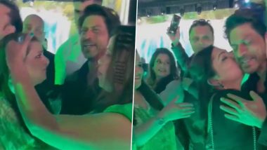 Woman kisses Shah Rukh Khan: दुबई में एक महिला ने शाहरुख खान को किया किस, भड़के फैंस बोले - इसे जेल में डालो (Watch Video)