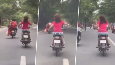 Viral Video- Girl Dancing On Bike: पापा की परी ने चलती स्कूटी पर किया डांस, अन्य लोगों की जान डाली जोखिम में