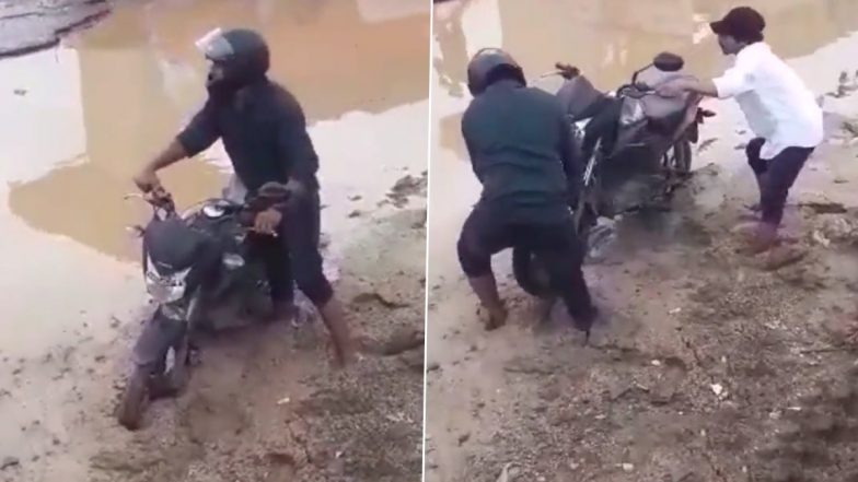 Video: सड़क पर जमा कीचड़ से अपनी बाइक निकालने के लिए संघर्ष करता दिखा बाइक सवार