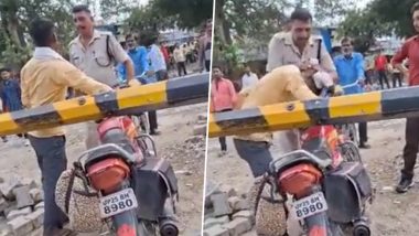 Viral Video: रेलवे क्रॉसिंग के नीचे से बाइक निकाल रहा था शख्स, इतने में पहुंचा RPF जवान और फिर...