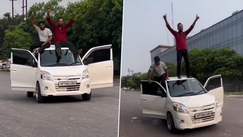 Noida Car Stunt Video: इंस्टाग्राम रील बनाने के लिए दो लोग चलती कार के ऊपर बैठे, क्लिप वायरल होने के बाद पुलिस ने लगाया जुर्माना