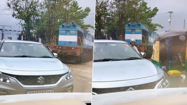 Train Stuck in Varanasi Traffic Viral Video: वाराणसी में ट्रैफिक के चलते रोकी गई ट्रेन, यूजर्स ने वीडियो शेयर कर कहा- 'यह केवल भारत में होता है'
