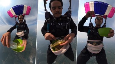 Viral Video: जमीन से सैकड़ों फीट ऊपर हवा में खाता दिखा शख्स, पैराग्लाइडिंग करते समय लिया नाश्ते का स्वाद