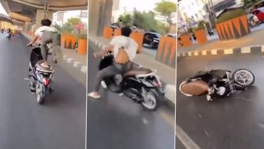 Bike Stunt Goes Horribly Wrong: व्यस्त सड़क पर स्कूटी पर स्टंट करता दिखा शख्स, बैलेंस बिगड़ने के बाद गिरा- Video