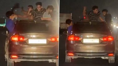 Dance on Moving Car: बेंगलुरु में चलती कार की सनरूफ और खिड़की से बाहर निकलकर खतरनाक स्टंट, वीडियो वायरल होने पर पुलिस 4 युवकों को दबोचा