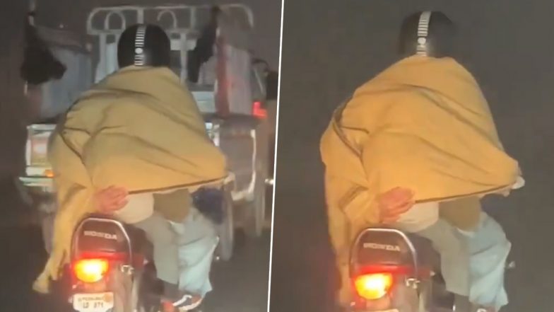 बाइक चलाते समय बेटे को ठंड से बचाने के लिए पिता ने किया ये काम, इमोशनल कर देगा यह Viral Video