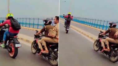 Stunt Video Viral: पुलिस के सामने स्टंटबाजी, पहिया उठाकर चलाने लगा बाइक, वीडियो वायरल होने के बाद एक्शन