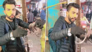 आस्तीन के सांप! हाथ में लटका कर दर्जनों सांपों को बेचता दिखा शख्स, Viral Video ने उड़ाए लोगों के होश