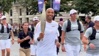 Thierry Henry Carries Olympic Flame: फ्रांसीसी फुटबॉलर थिएरी हेनरी ने बैस्टिल डे पर पेरिस में ओलंपिक मशाल लेकर लगाई दौड़, देखें वीडियो