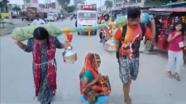 UP  Kanwar Yatra Viral Video: बेटे-बहू ने बूढ़ी मां को कंधे पर बैठाकर कांवड़ यात्रा के लिए निकले, वीडियो वायरल होने पर लोगों ने की तारीफ