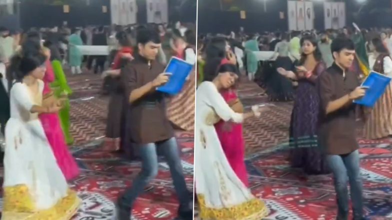 Viral Video: 'पढ़ने वाले बच्चे कहीं भी पढ़ लेते हैं', नवरात्रि के गरबा में किताब पढ़ते हुए डांस करता दिखा युवक; वीडियो वायरल