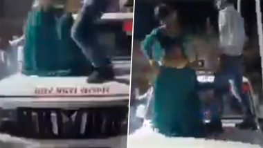 VIDEO: गजब है! झांसी जिले में SDM की गाड़ी पर चढ़कर युवक और युवती ने लगाएं ठुमके, वाहन का हूटर और नीली बत्ती भी जलाई, वीडियो वायरल