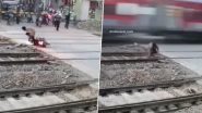 Viral Video: शख्स बाइक से रेलवे क्रॉसिंग कर रहा था पार, सामने से आ रही तेज रफ़्तार ट्रेन से इस तरह सेकंड में बची जान, देखें वीडियो