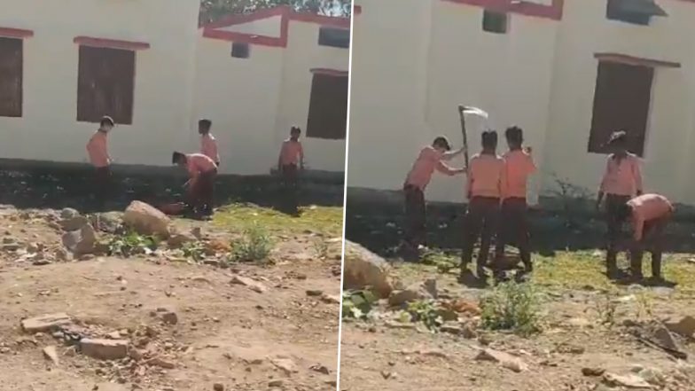 VIDEO: स्कूल के बच्चों के हाथों में किताबों की जगह दिखाई दिया फावड़ा, पढाई की जगह पर कर रहे है खुदाई का काम, झांसी जिले का वीडियो आया सामने