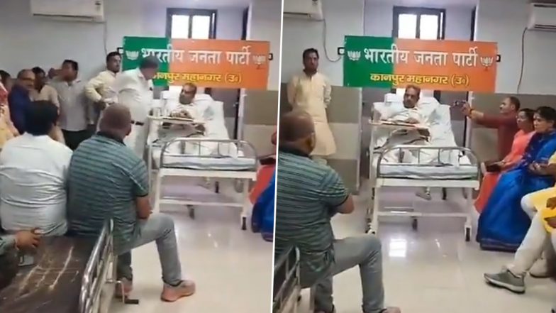 VIDEO: पैर टूटने के बाद हॉस्पिटल में नेता हुए एडमिट, वार्ड को ही बना दिया ऑफिस, कानपुर के BJP जिलाध्यक्ष ने कार्यकर्ताओं की ली बैठक, पीछे बोर्ड भी लगाया