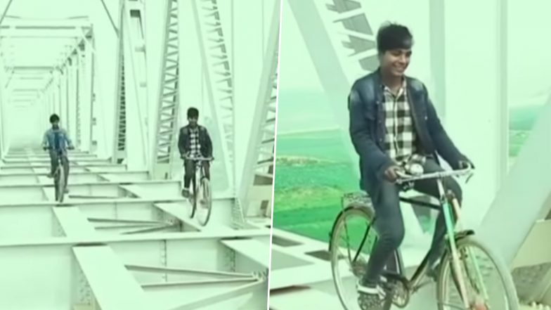 Viral Video: नदी के ऊपर बने ब्रिज की पतली पट्टी पर साइकिल चलाते दिखे दो लड़के, स्टंटबाजी का हैरान करने वाला वीडियो हुआ वायरल