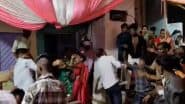 VIDEO: शादी में कूलर के सामने खड़े होने को लेकर मचा बवाल, लात-घूंसे और बर्तन तक चले, मारपीट का वीडियो वायरल